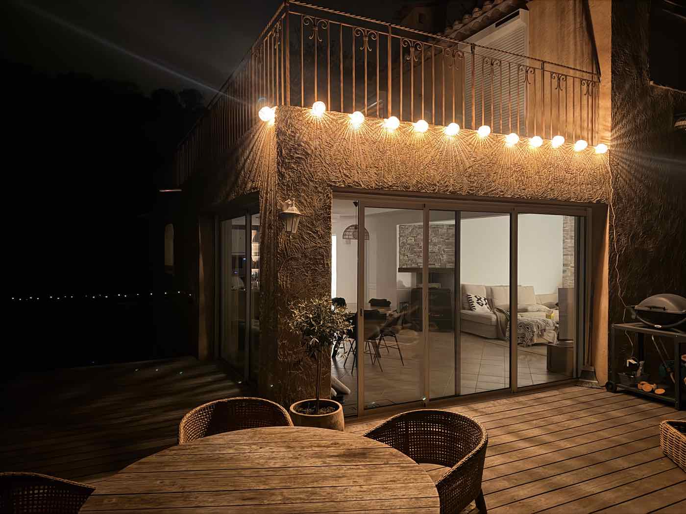 String lights on the upper terrace at night